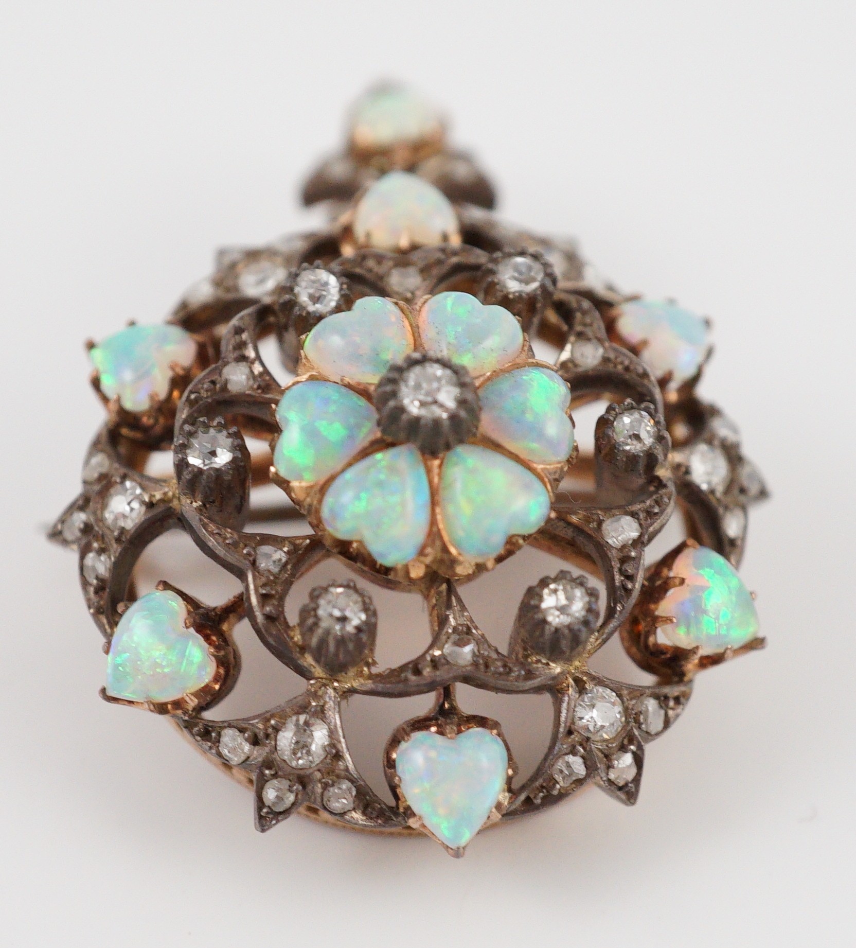 A late Victorian gold silver and diamond circular cluster pendant brooch, 3.5cm, gross 17.5 grams